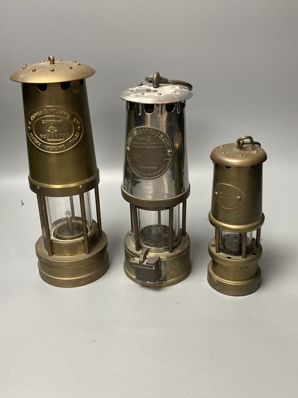 Three brass and chrome miners lamps, 25cm high